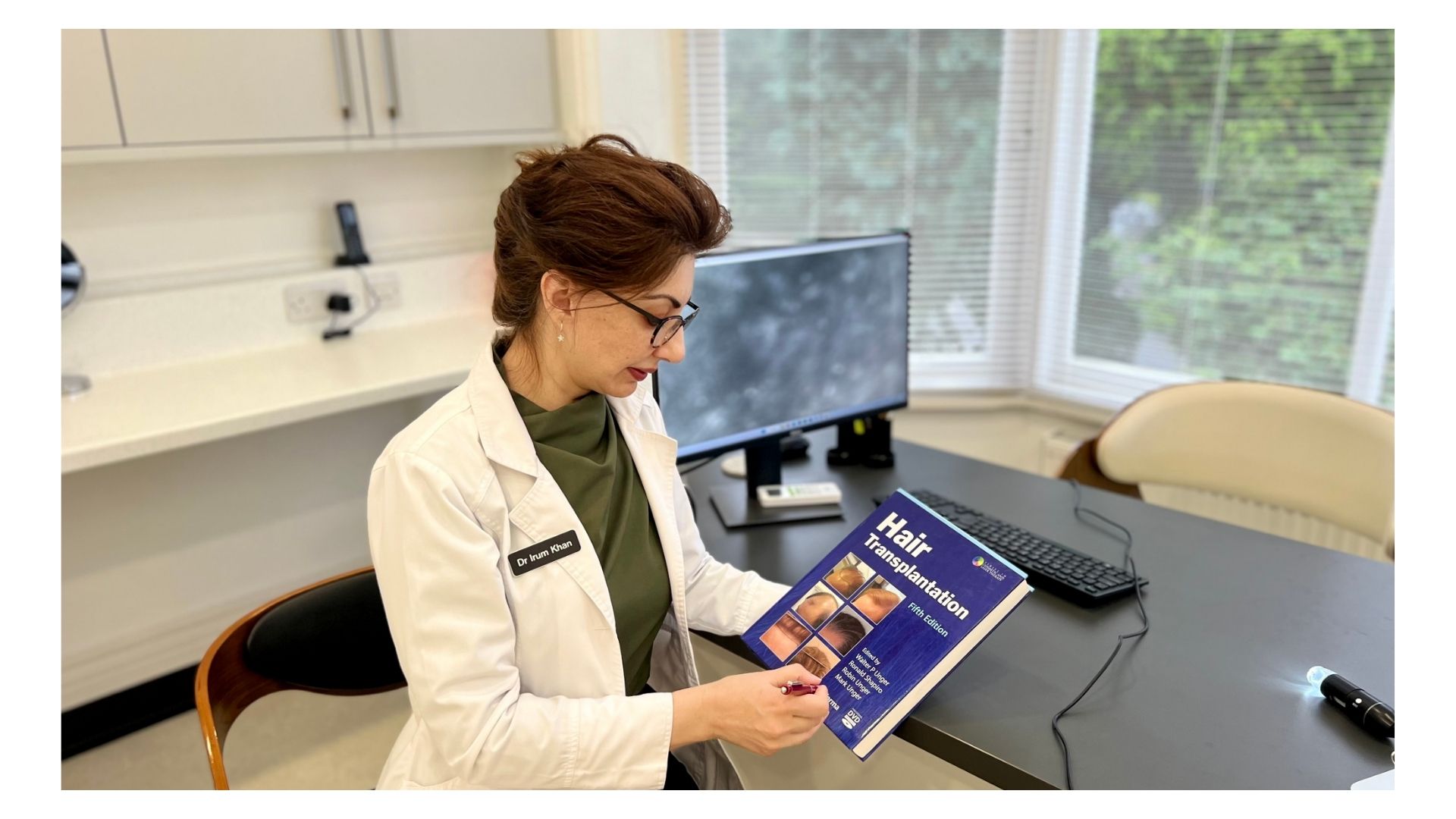 Irum viewing a hair transplantation book